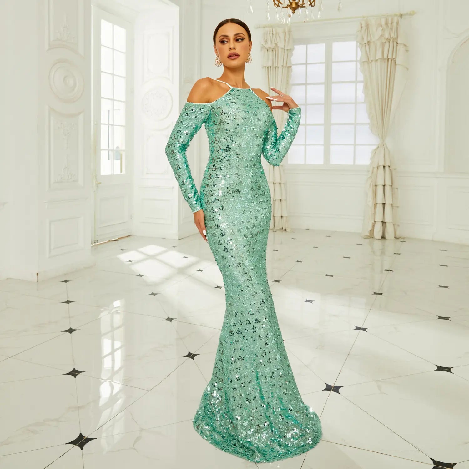 a shimmering mint green long sleeve banquet sequined sheath gown featuring an off-the-shoulder neckline and fishtail design