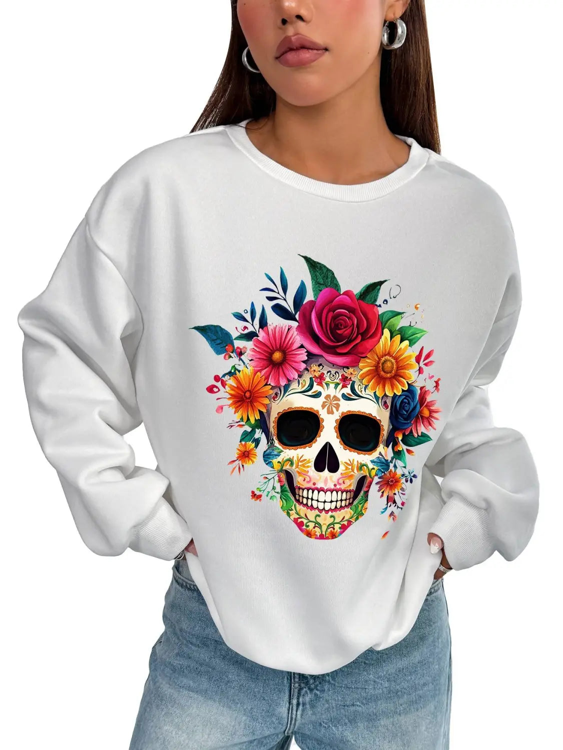 White crew neck sweatshirt with a vibrant colorful floral sugar skull design ideal for daily wear as a basic long sleeve garment.