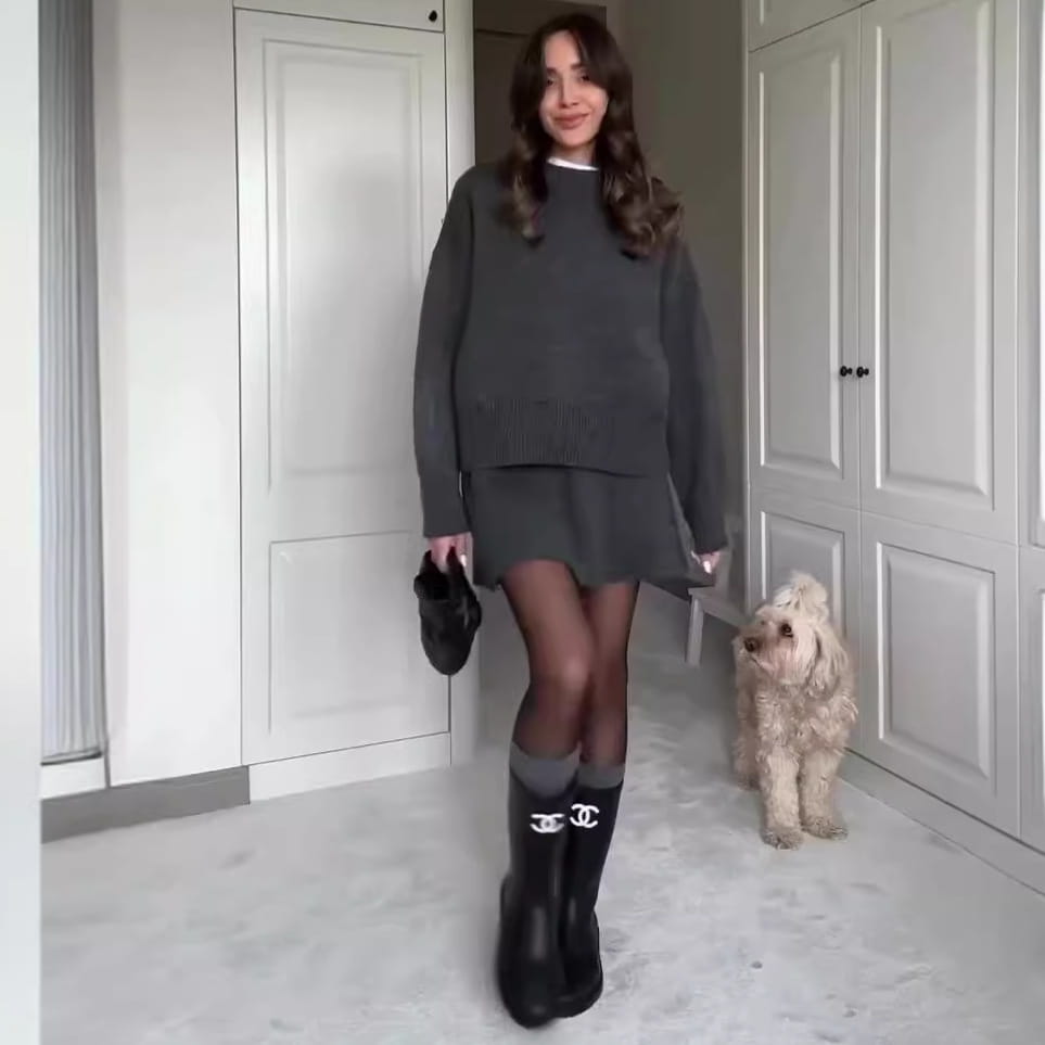 black chanel logo knee-high boots paired with green long sleeve sweater skirt sets showcasing knit casual pieces.