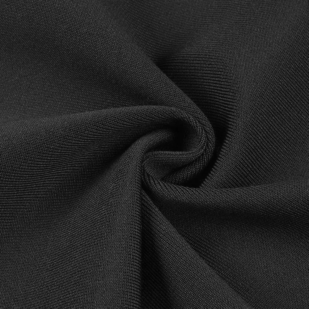 black ribbed knit fabric with a textured stretchy weave featured in a black backless bandage gown with a white floral design and backless bandage chest detailing