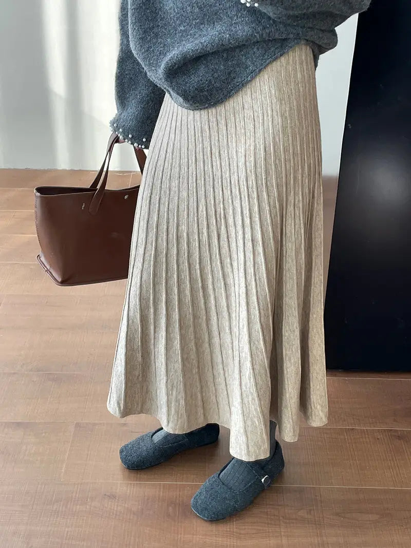 beige korean elastic waist knitted pleated midi skirt made of soft textured knit fabric with an elastic waist for comfortable fit