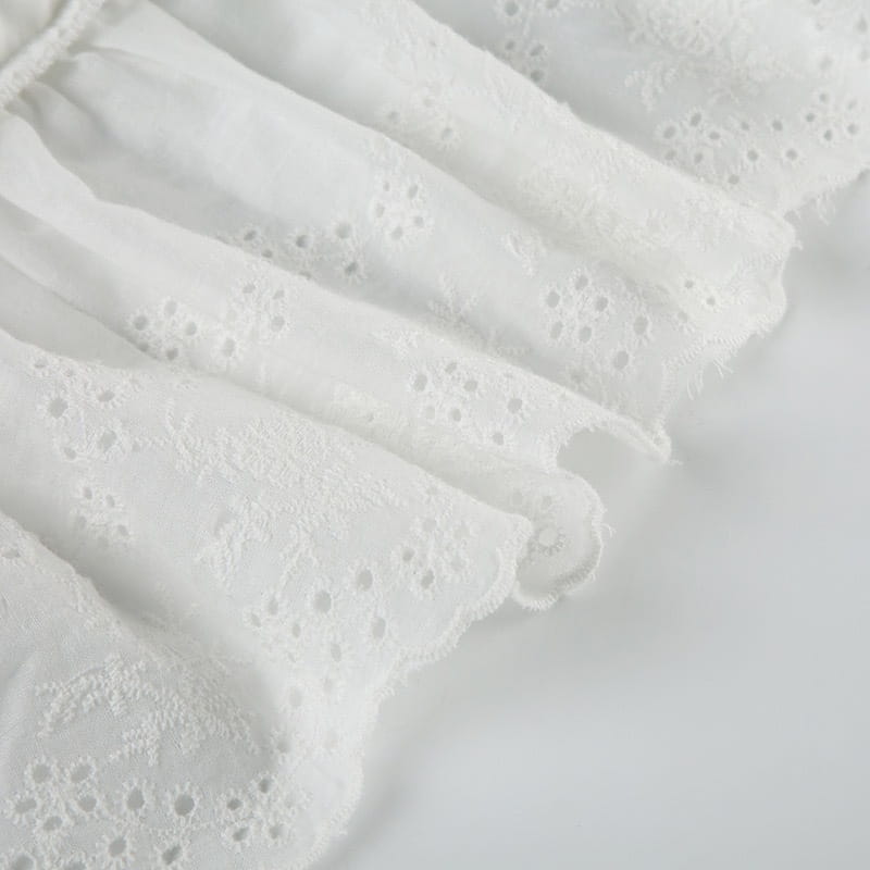 white eyelet lace fabric with delicate floral patterns and soft flowing texture on french high waist elastic double layer lace pantskirt