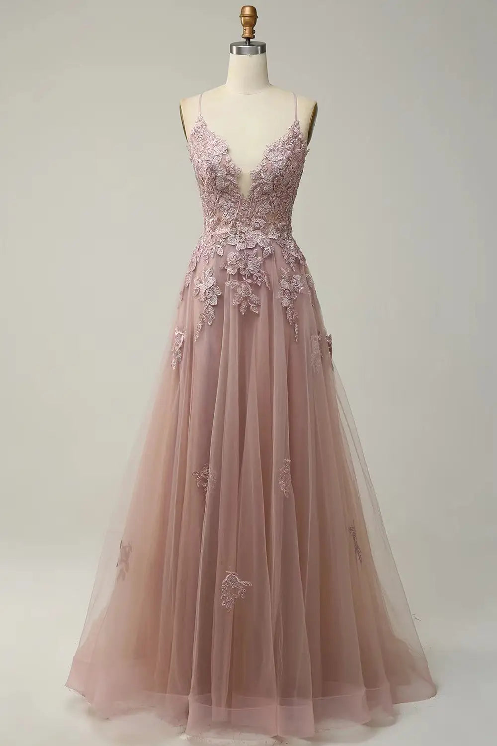 a delicate blush pink lace women evening dress with v-neckline and thin evening dresses suspender straps featuring intricate floral embroidery along the bodice and skirt