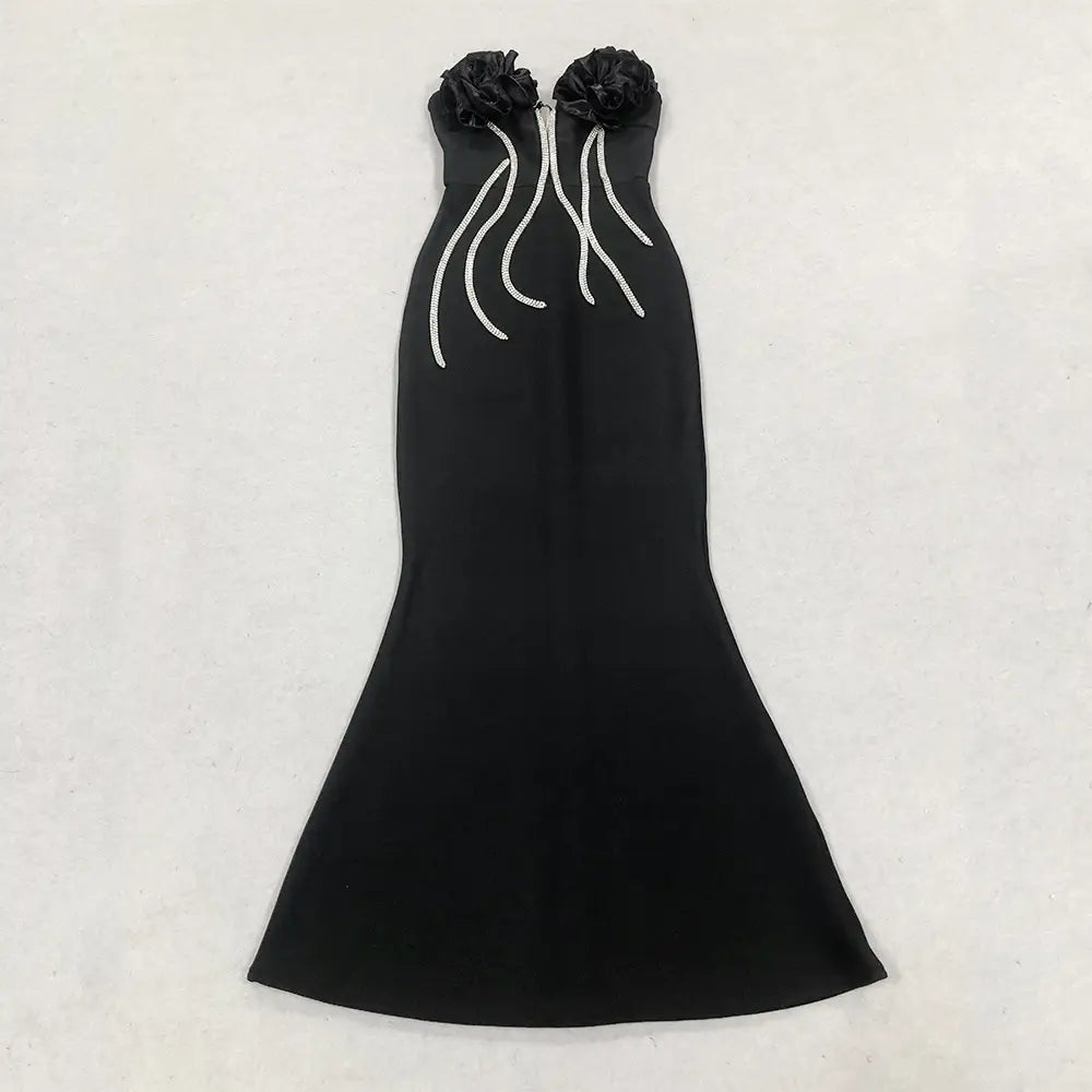 black strapless mermaid gown with ruffled floral embellishments at the bust and white beaded detailing along the front in the style temperament socialite flower chain evening dress