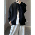 Black ribbed knit cardigan with dark buttons made from jacquard mink cashmere for a luxurious cashmere knitted sweater