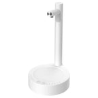 White minimalist desk lamp with metallic silver nozzle paired with dark blue smart desk dispenser electric water system