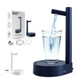 Dark blue smart desk dispenser electric water with navy blue cylindrical design and glass cup beneath the spout