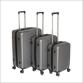 Set of three dark gray hard shell suitcases with black trim and silver telescoping handles for versatile travel use