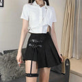Black asymmetric pleated skirt with dark leg ring buckle straps and matching thigh-high garter belt ring asymmetric design