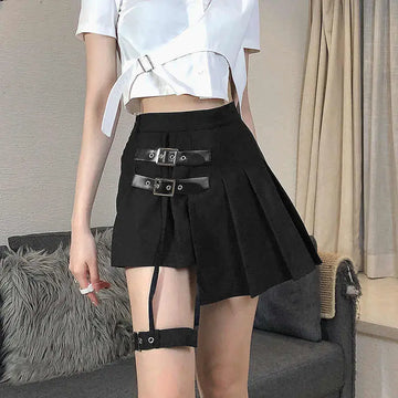 Black asymmetric pleated skirt with dark leg ring design featuring leather straps and silver buckles in ring asymmetric design