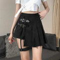 Black asymmetric pleated skirt with dark leg ring and dual black leather belt straps with silver-toned buckles
