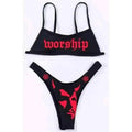 Black bikini set featuring dark offset printing split design with red worship text on top and devil face on bottom
