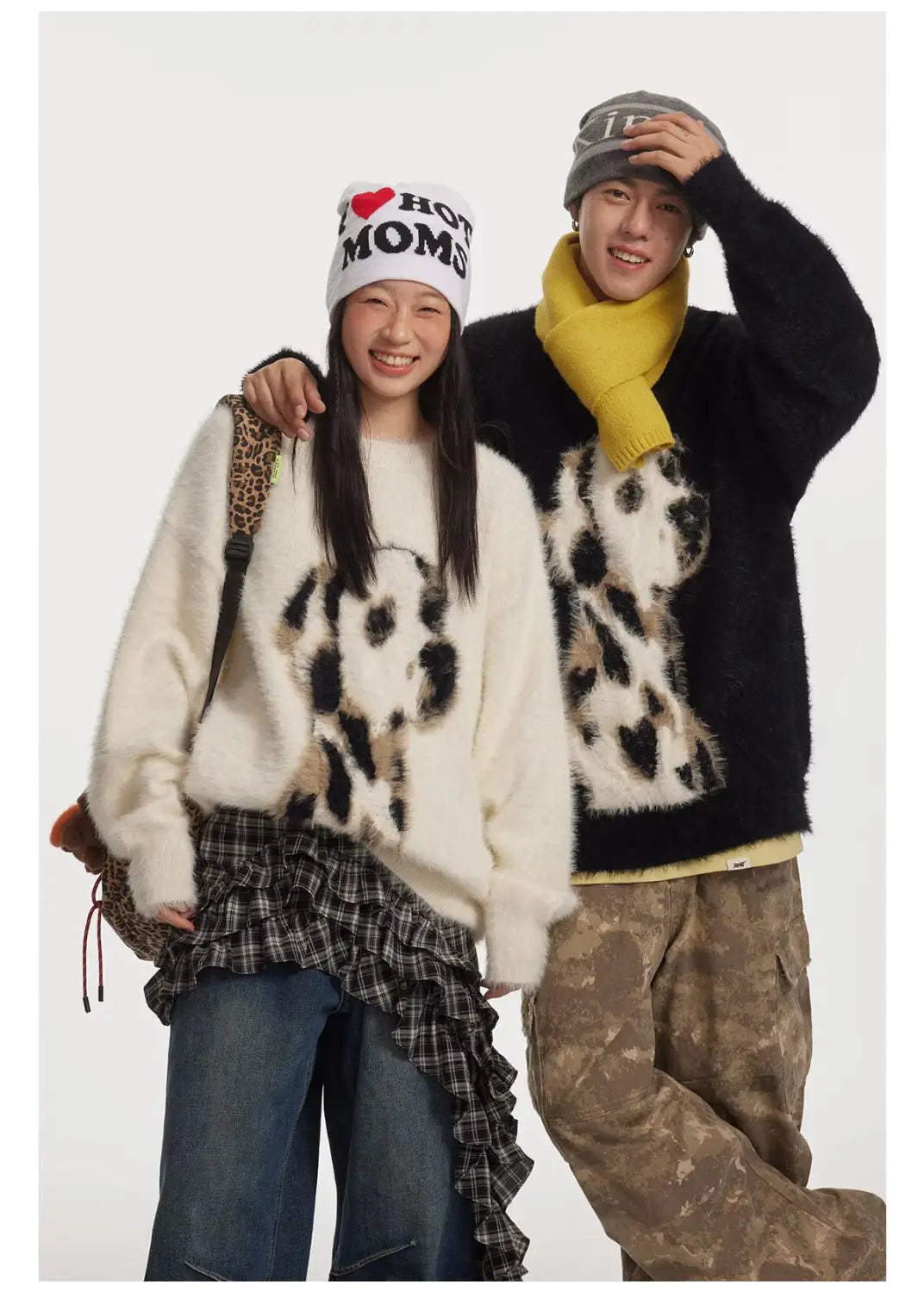 white fuzzy sweater featuring black and tan leopard print design made of jacquard mink cashmere knitted fabric for stylish comfort