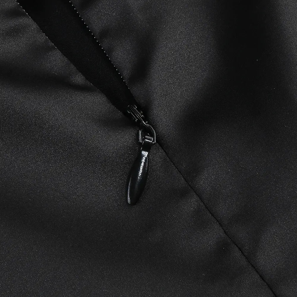 black zipper with a sleek glossy pull tab on smooth fabric in the one-shoulder slit mop black dress two-piece set featuring set sexy lacing