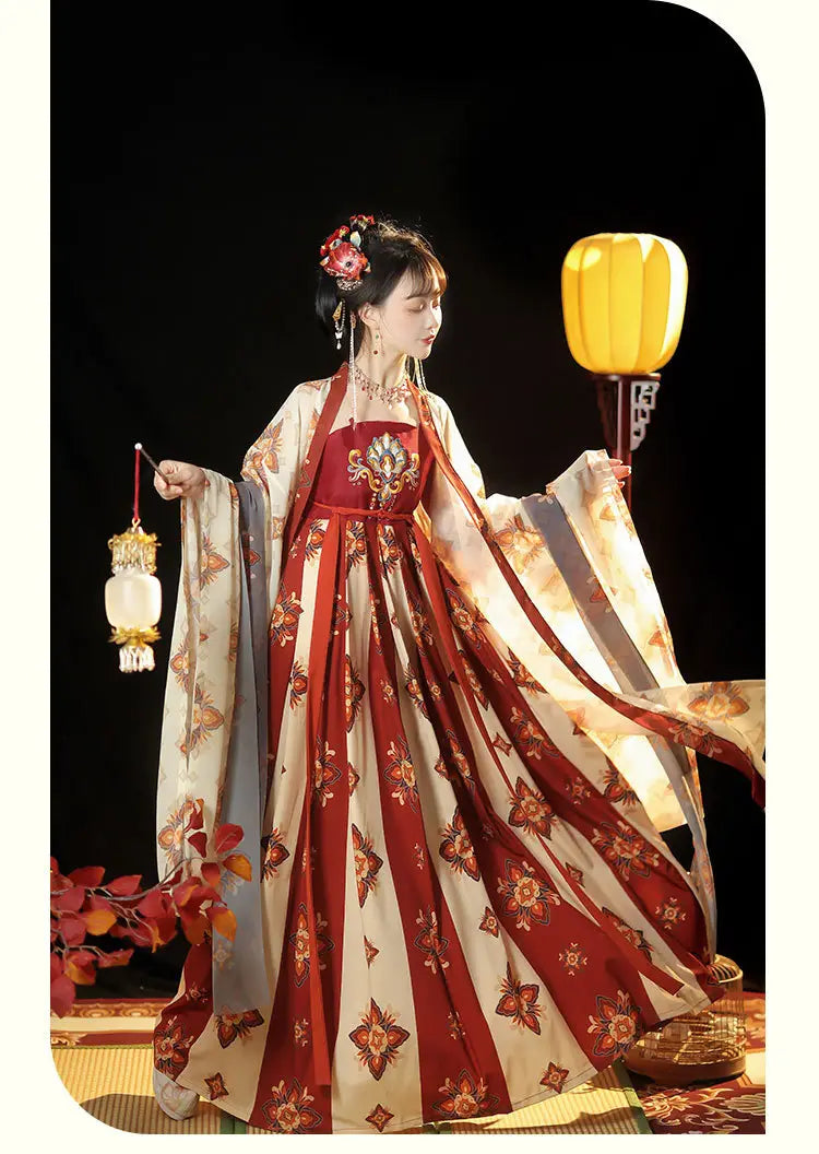 A woman wears a flowing red and cream-colored traditional Tang imperial han chinese clothing recovery dress adorned with intricate floral embroidery.