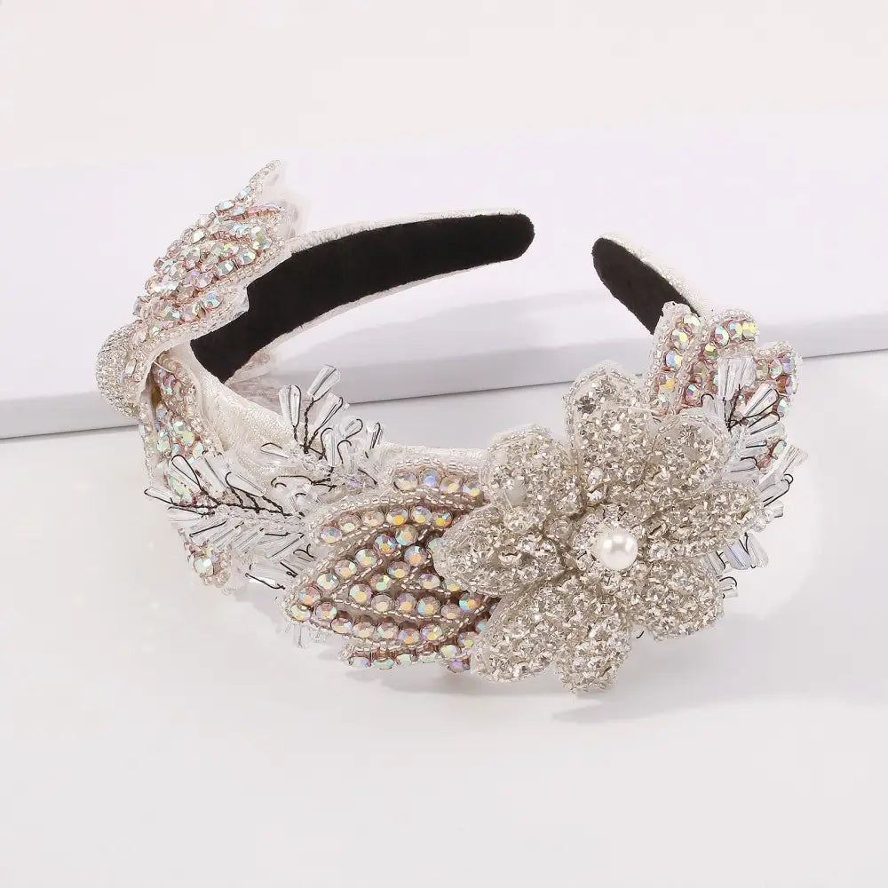 A sparkling silver beaded vintage crystal floral temperament hair accessory featuring a central floral design and delicate leaf accents.
