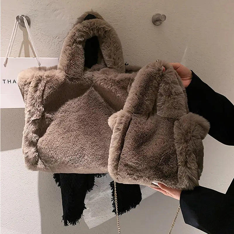 pink faux fur chain plush handbag featuring a soft fluffy texture with matching handles designed as a winter bags chain accessory