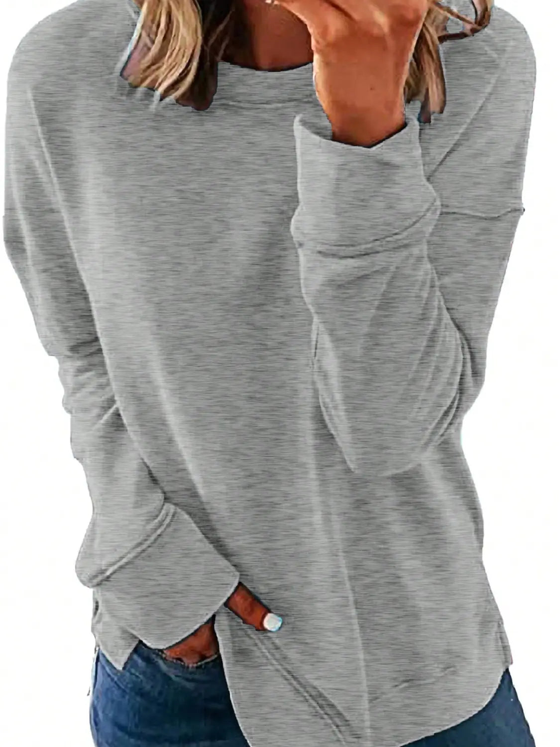 a soft heather gray long sleeve sweatshirt with a relaxed fit and side pockets perfect for womens sweatshirts fall fashion and casual long sleeve tops