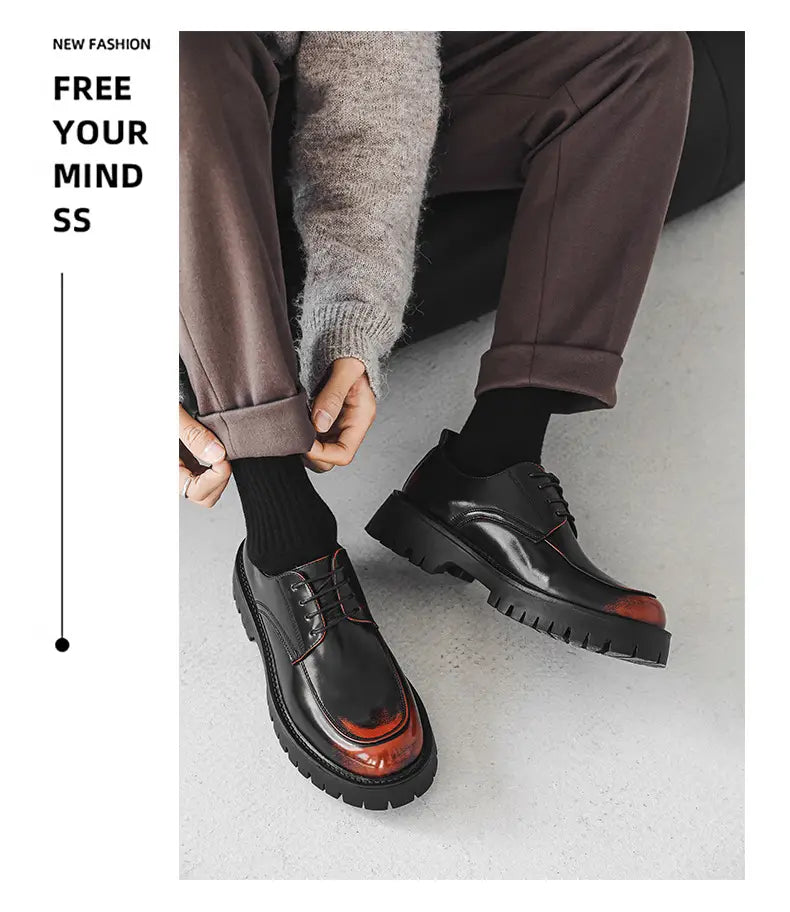 black leather casual leather shoes featuring a glossy finish and contrasting red orange accents on the toe cap with red stitching