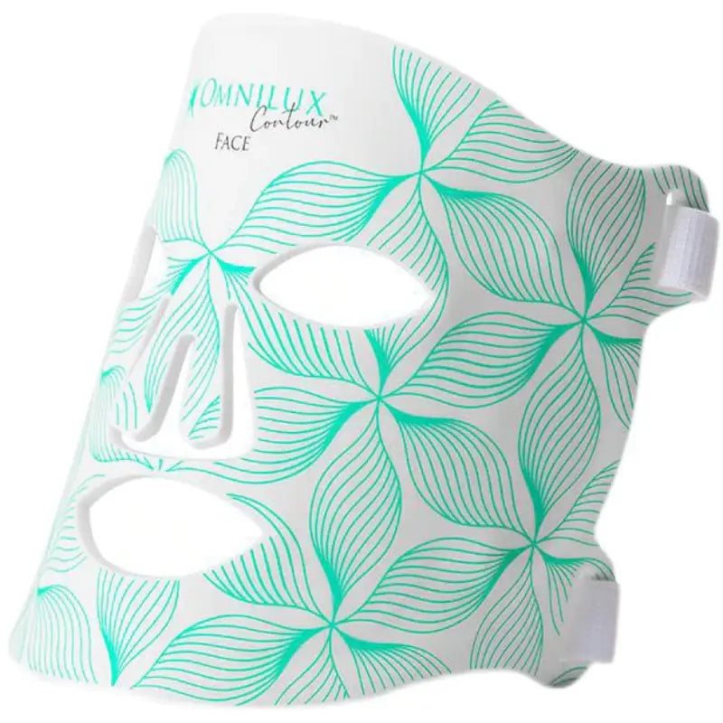 White face mask with teal leaf-patterned design and adjustable side straps branded as omnilux contour face used with Minilux collagen anti aging beauty instrument.