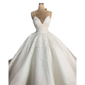 A white lace wedding dress with deep v-neck lace and voluminous skirt on a mannequin embodying romantic aura
