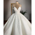 A white lace wedding dress with deep v-neck lace appliqués and a voluminous skirt exuding romantic aura on a mannequin