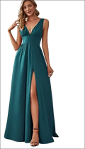 Emerald green satin maxi swing dress with deep v-neck sleeveless design and high slit for elegant occasions