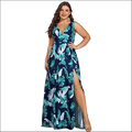 A navy blue swing dress with a deep v-neck sleeveless design featuring a tropical leaf print and adjustable waistband