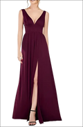 A flowing burgundy satin deep v-neck sleeveless swing dress with a high slit perfect for elegant occasions