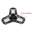 Black triangular deformable lamp garage light with three illuminated panels and central gear-like adjustable mechanism
