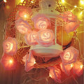 Delightful rose lights featuring pink led roses nestled in a woven basket for decorative use