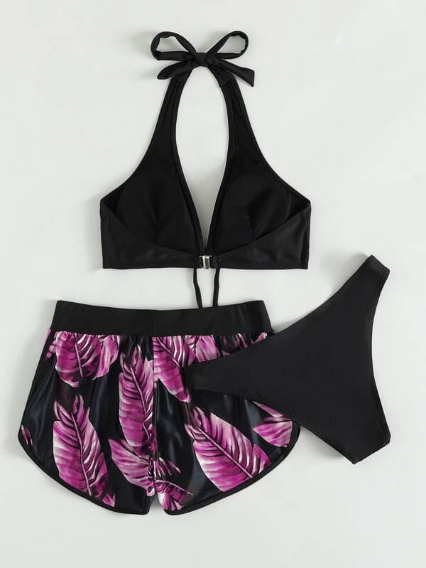 black halter top leaf print bikini with deep v-neckline and adjustable tie-backs paired with matching high-waisted shorts featuring vibrant purple leaves on black background in 3pcs leaf print shorts fashion summer set