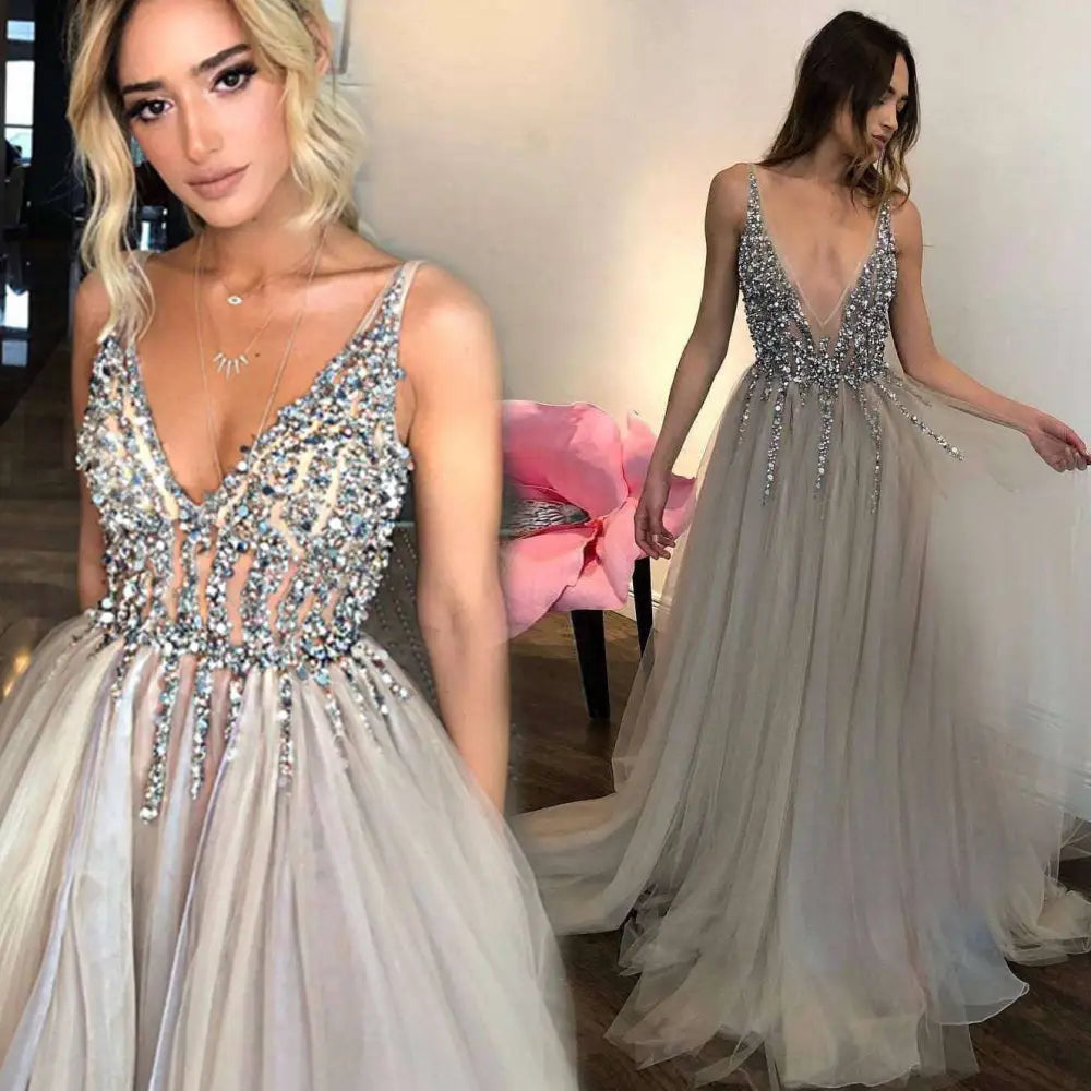 Diamond grey banquet beaded evening dress featuring a shimmering silver beaded gown with deep v-neck and flowing tulle skirt