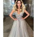 Diamond grey banquet beaded evening dress featuring a shimmering silver beaded gown with deep v-neck and tulle skirt