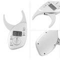 Digital body fat caliper in white with a sleek ergonomic design and lcd display showing precise measurements