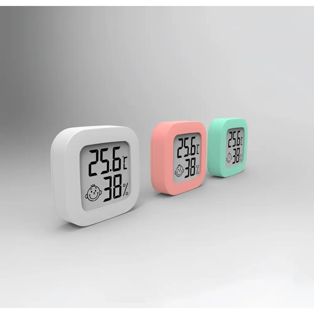 Digital display temperature and humidity meter in pastel colors showing 25.6°c humidity measurement and smiling face icon