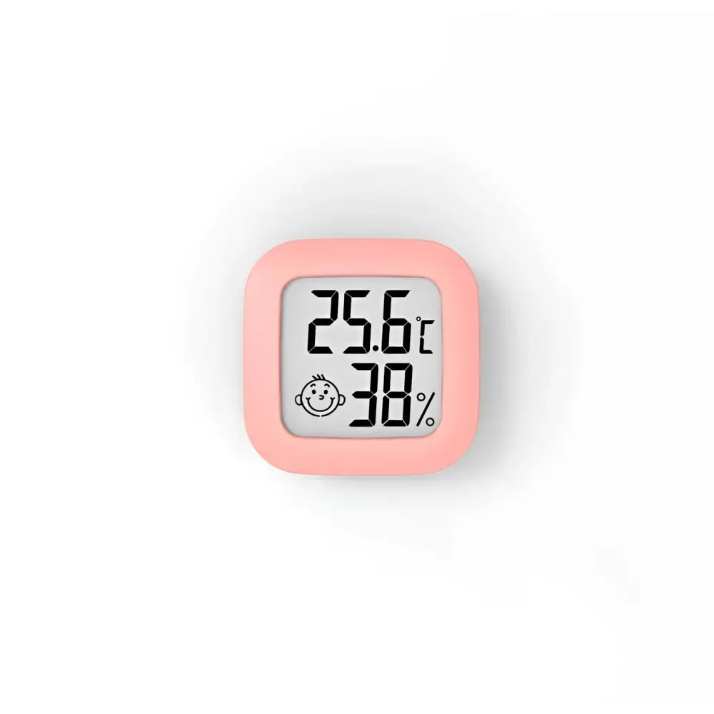 Pink square digital display temperature and humidity meter with smiling baby face icon for humidity measurement
