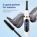 White and gold digital heated eyelash curler with black textured brush tip and digital display for rechargeable use