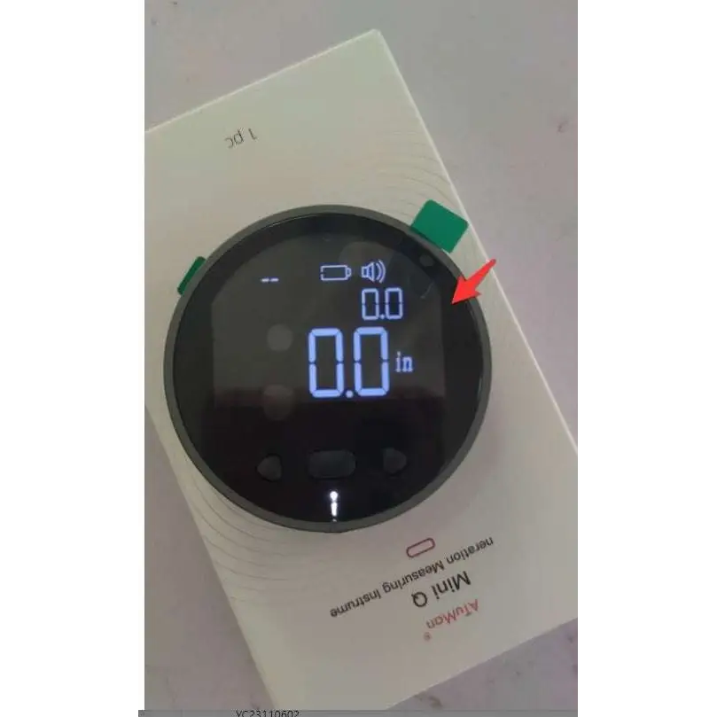 White circular electronic measuring ruler with black bezel and blue led display showing precise electronic measuring in inches