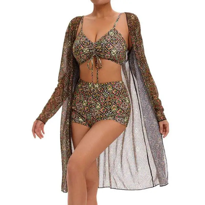 A woman wears a digital printing pleated tie bikini in earthy tones with a matching sheer long-sleeved cover-up