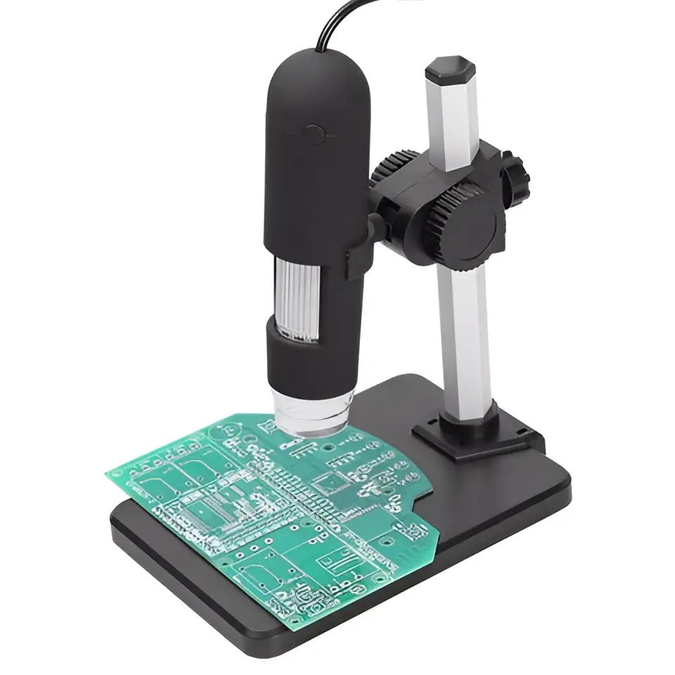 Black handheld digital usb microscope camera with silver accents on adjustable arm capturing green circuit board details