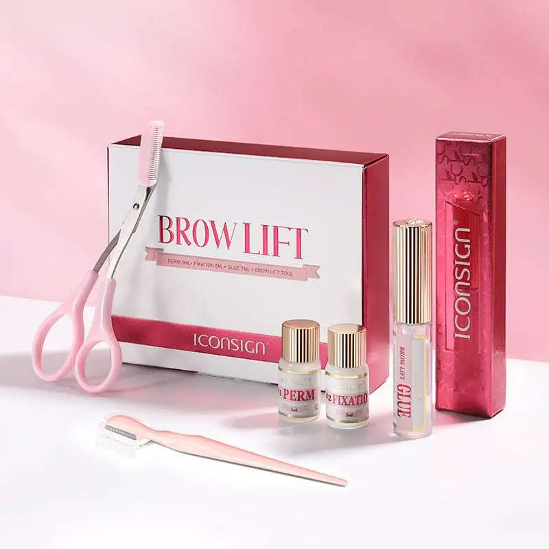 Pink-handled professional brow lamination kit with scissors comb and adhesive bottles in branded lamination eyebrow kit box