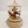 Wooden diy dancing music box featuring a central brown horse and cream horses on a light wood christmas train canopy