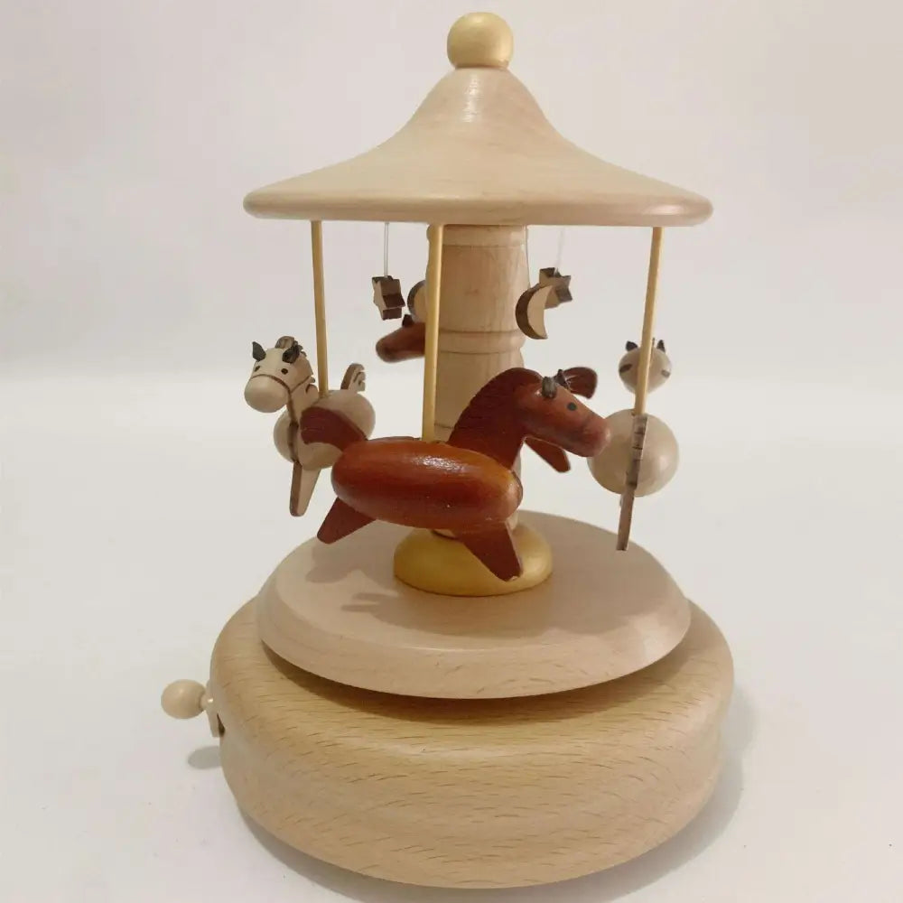 Wooden diy dancing music box featuring a central brown horse and cream horses on a light wood christmas train canopy