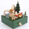 Green wooden diy dancing music box featuring a miniature christmas train scene with snowman and trees