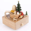 Wooden diy dancing music box featuring a christmas train, house, trees, and snowman in festive colors