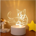 A glowing white 3d cat lamp featuring a translucent led night light with colorful touch remote control lights