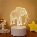 A glowing white 3d elephant led night light with wireframe design on a cylindrical base featuring colorful touch remote control lights