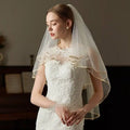 Elegant ivory lace wedding veil with double champagne edge metal comb and delicate gold trim with sheer fabric