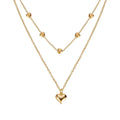 Gold-toned double layer heart pendant fine chain necklace with three delicate chains and small heart charms